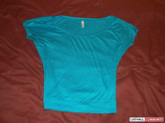 Blue light-fitting t-shirt. Never worn.