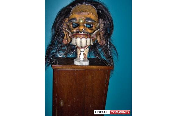 2 very scary Indonesian masks. 1 Polynesian mask. 
