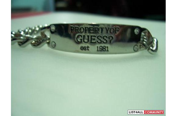 GUESS braceletsays " property of Guess "