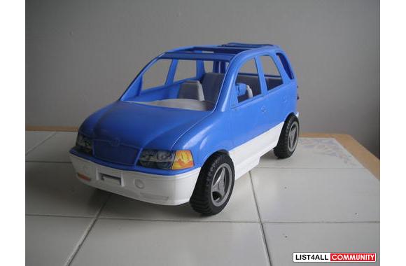 Blue Minivan with opening hatch.