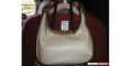 Coach purse.&nbsp; Cream/white/brown leather.&nbsp; Smaller size, but 