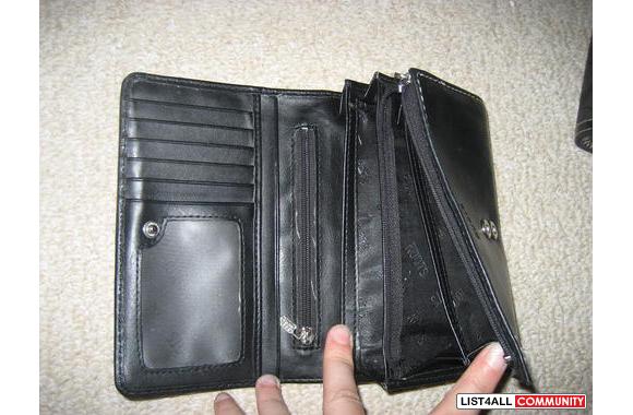 ROOTS wallet. I think it's big enough for a checkbook.
