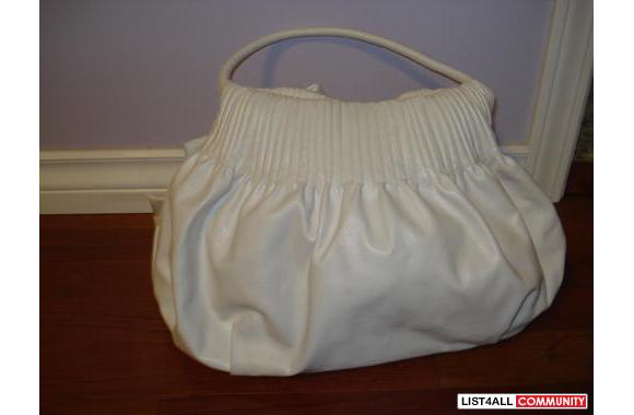 Adorable white faux-leather purse perfect for hitting the beach and su
