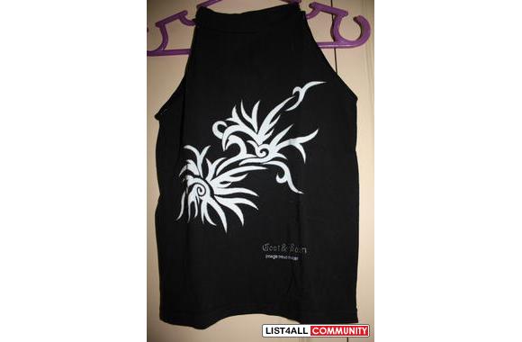 Black sleeveless top with cool design, goes up to neck