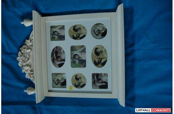 Wooden frame for photos, under glass