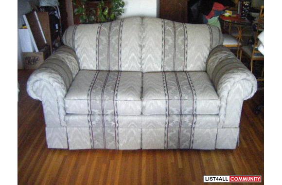 A very nice loveseat that has been covered for 2 years