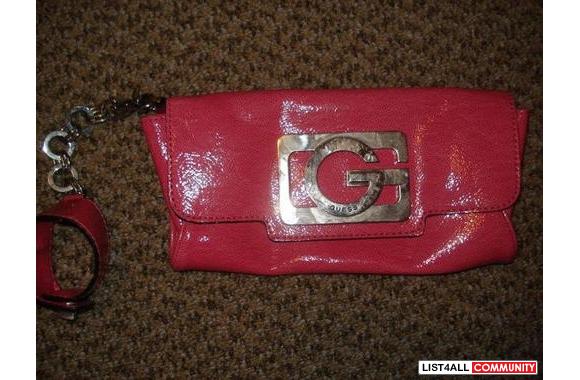 Guess bag. Hot pink. Shiny vinyl. Detachable handle with a hot pink wr