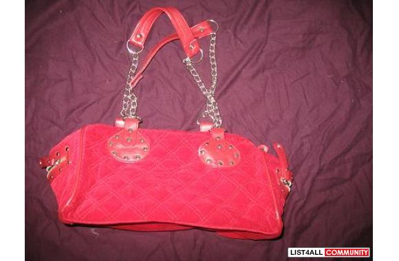 Red velvet bag with leather and metal straps
