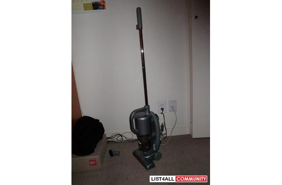 Vacuum cleaner. Small and not very strong. Better for bare floors.