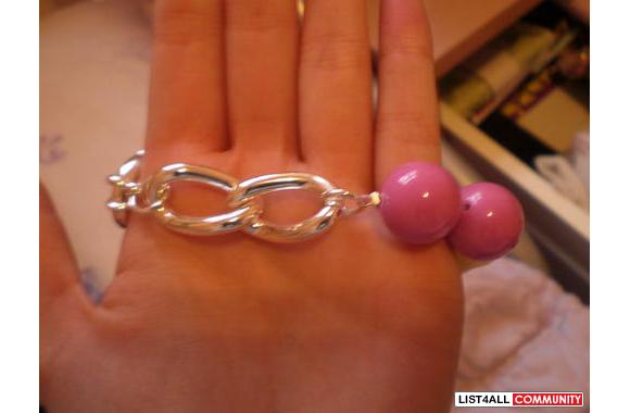Tinker bell bracelethas a skull in the middlesuper
