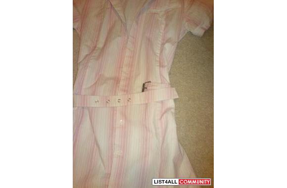 Long short sleeved dress shirt with a belt around 