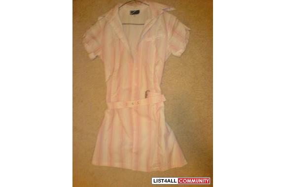 Long short sleeved dress shirt with a belt around 