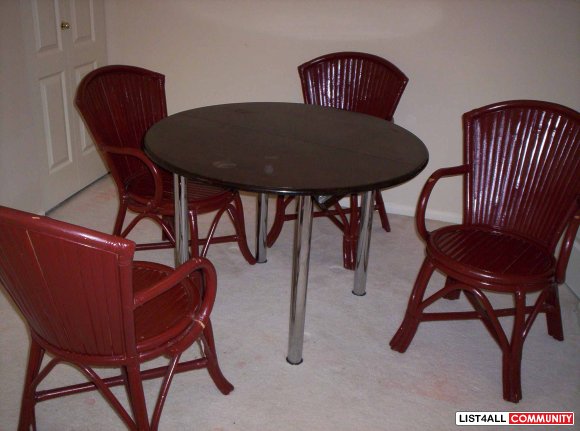 set of redwood dinning table with 4 ratten chairs