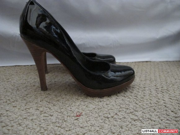 Black Shiny closed toes with cork heels. Size 6